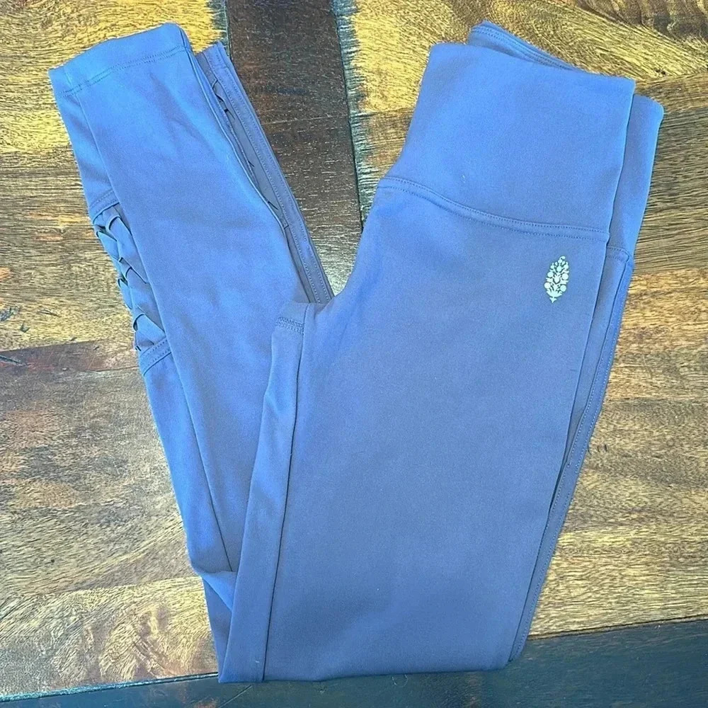 Free people movement leggings with braided detailing on legs. EUC size XS